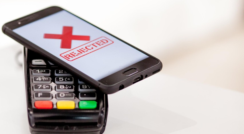 Merchant reviewing payment terminal transaction data