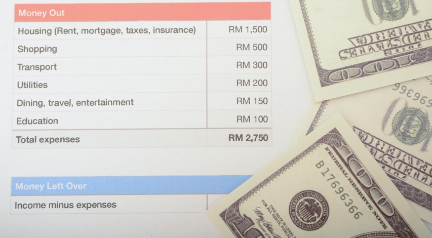 Person reviewing currency exchange rate documents