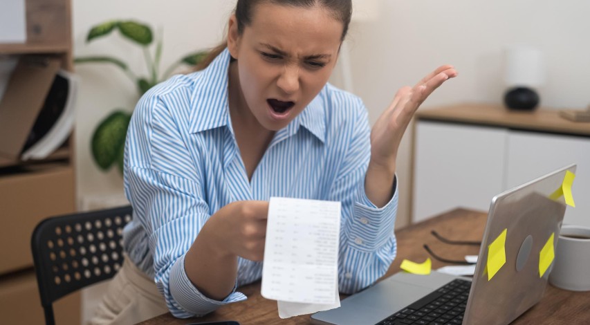 Confused customer reviewing incorrect billing statement