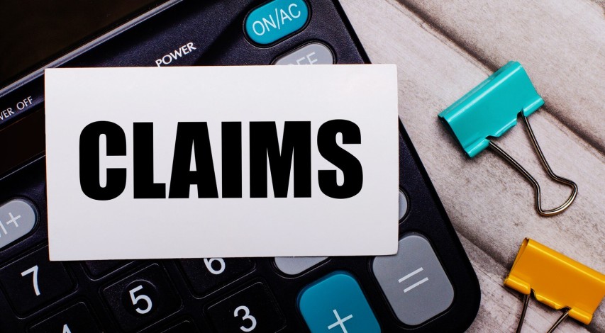 Merchant looking confused at financial documents