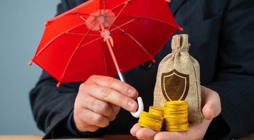 Person weighing financial risk on scale