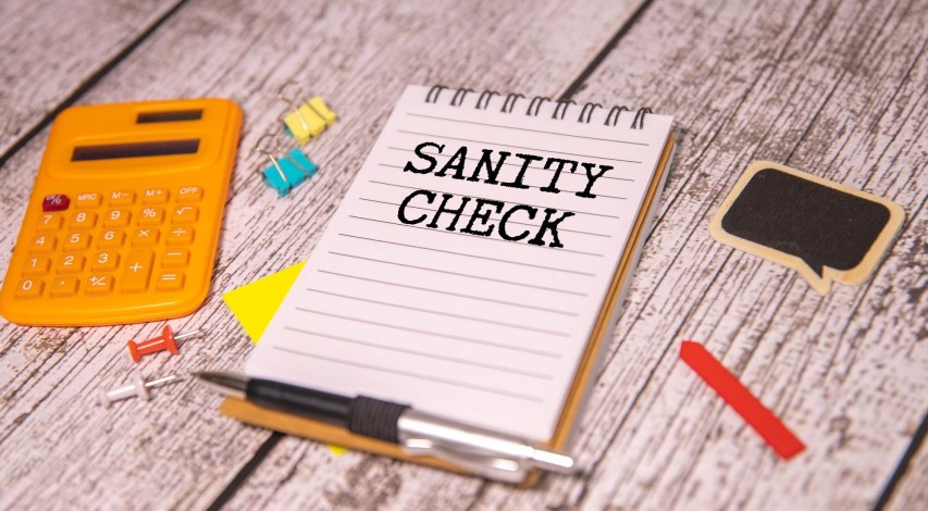 Person reviewing financial documents at desk