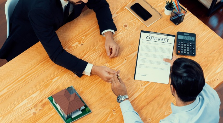 Person reviewing merchant contract terms document