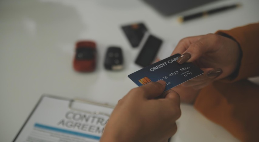 Business owner processing customer credit card payment
